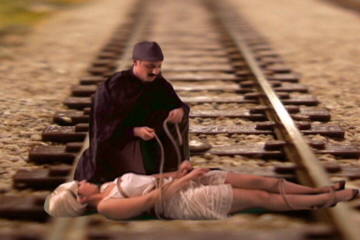 Cheryl tied to railroad tracks,train video,train video clip,railroad video,model railroad video,model train video,steam train video,free train video,steam trains video clip,model train dvd,model railroad dvd